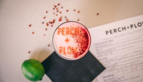 Top down view of a custom cocktail featuring lime and chili powder.