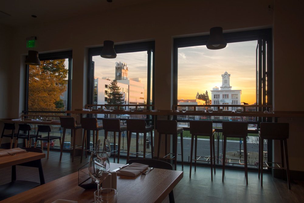 Dining room view over courthouse square at sunset.