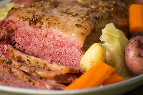 close-up of traditional St.Patrick's Day dinner of corn beef, cabbage, and roasted potatoes 